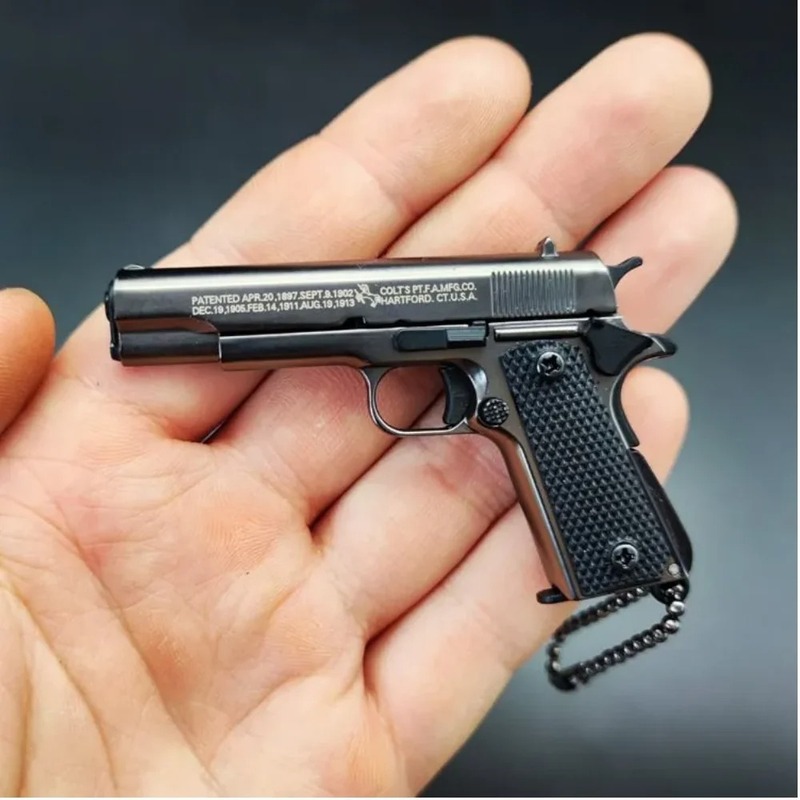 Miniature toy gun for play